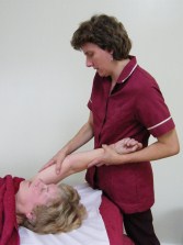 Julie Nicholls treating an arm and shoulder